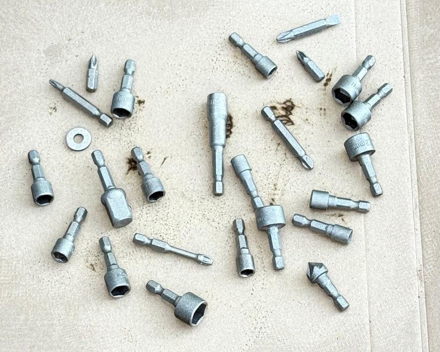 The same screwdriver and socket driver bits after laser cleaning, back to bare bright steel