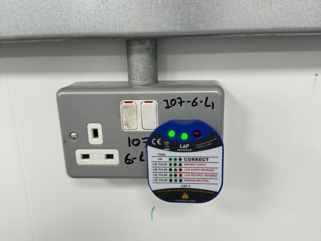 Metal clad double socket showing a correct reading on a plug in socket tester