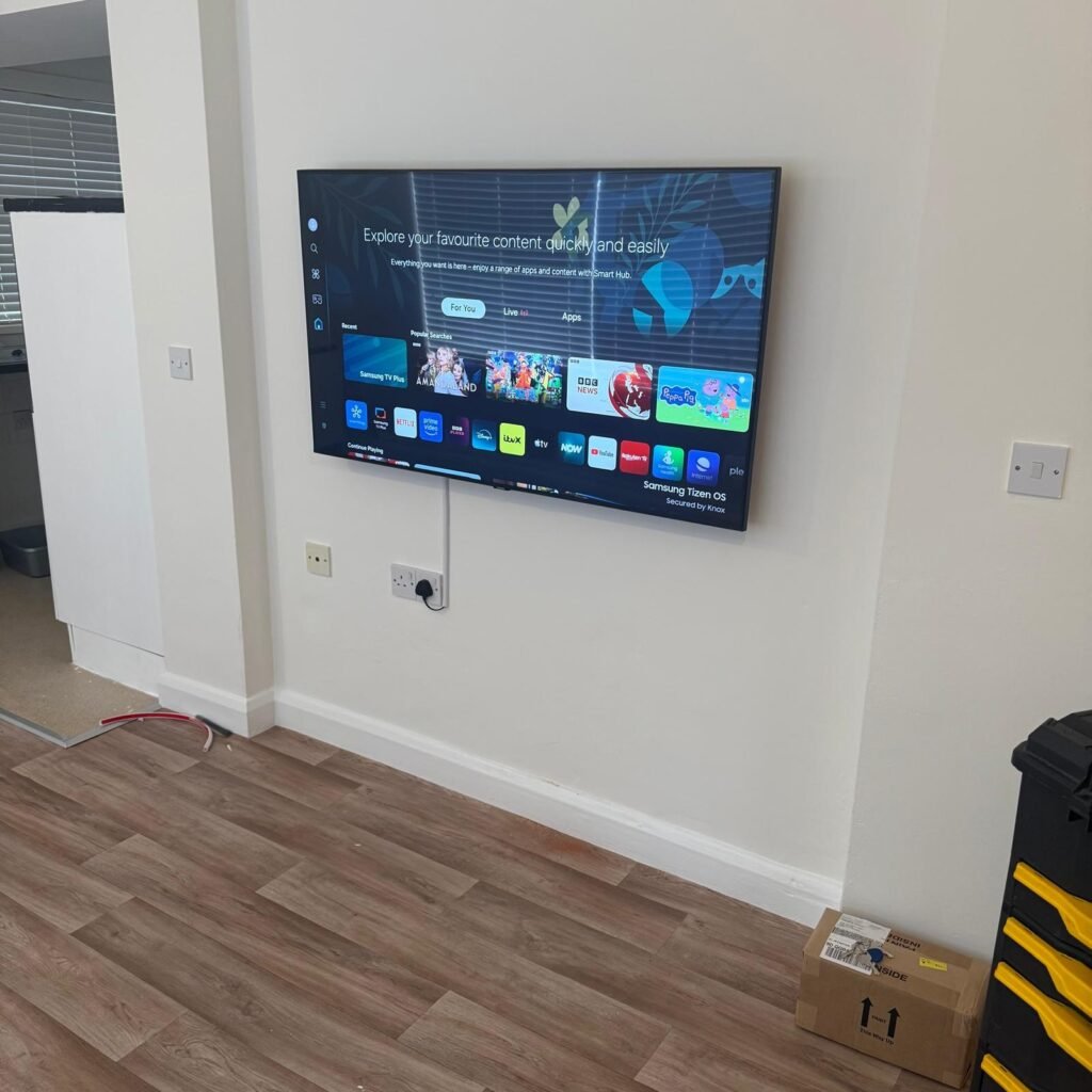 Samsung smart TV wall mounted flat to a living room wall in Hounslow